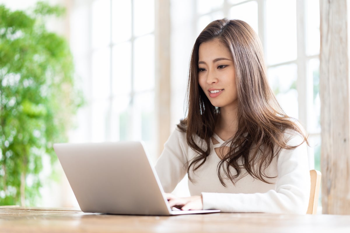 attractive asian woman using laptop computer